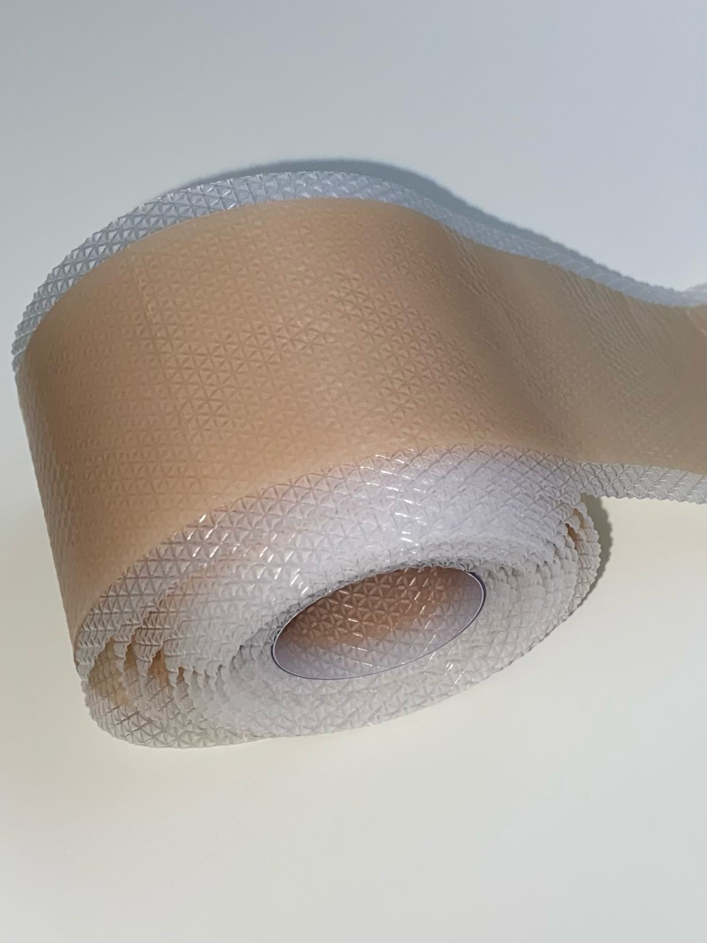 Aufgerolltes beigefarbenes Silikon-Gelblatt